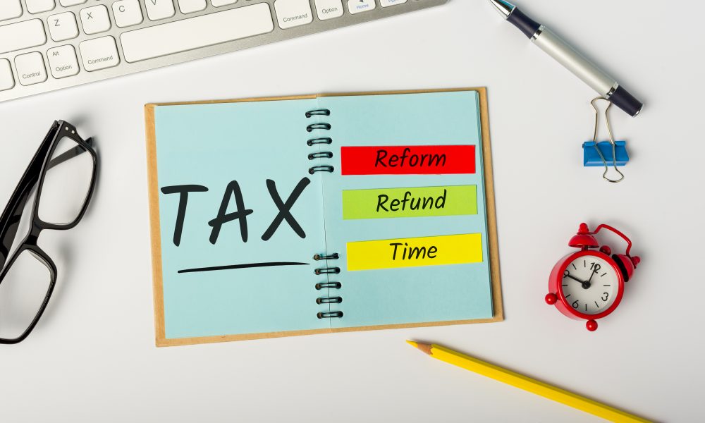 Tax Reform, Refund and Tax time. Records on workplace of an accountant or financial advisor